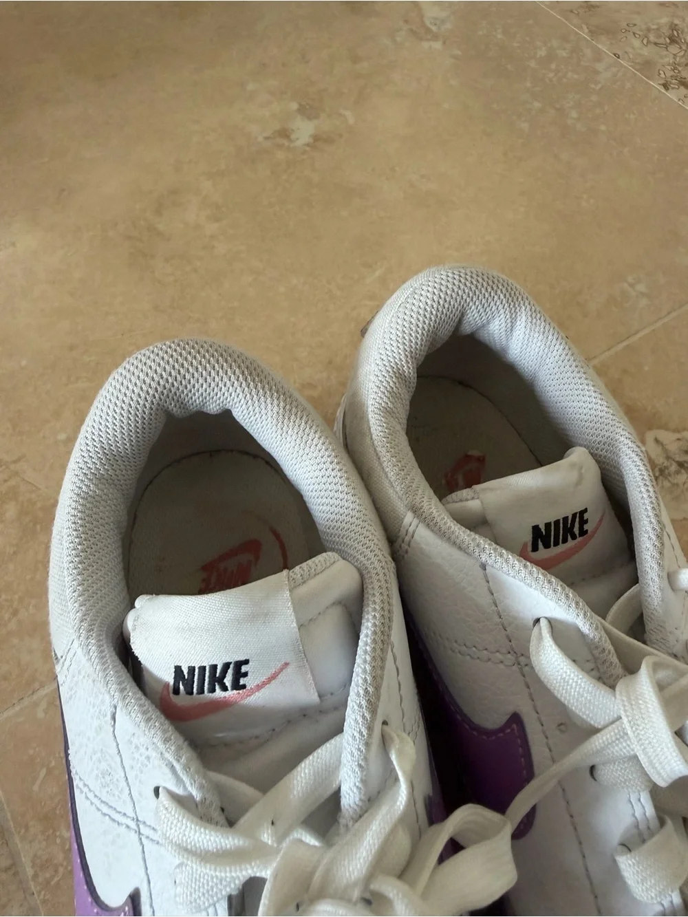 Nike Women’s White Low-Top Sneaker with Purple Swoosh Accent